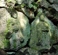 Figures carved in the stone around the trickling water